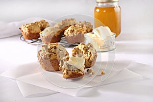 Bran muffins with butter and honey