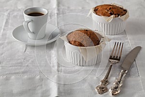 Bran muffins with raisins and a cup of coffee