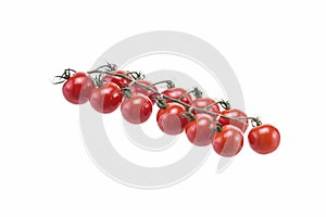 A branch of cherry tomatoes on a white background