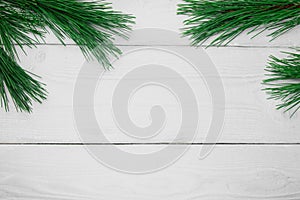 Branch christmas tree on white wooden vintage background