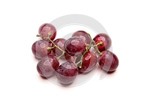 Branch of red grapes isolated on white background