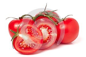 Branch of tomato and two halves isolated on white background