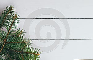Branches of fir tree on wooden background