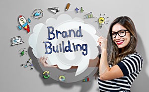 Brand Building text with woman holding a speech bubble