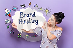 Brand Building with woman holding a speech bubble