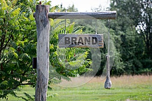 Brand concept. inscription on a wooden announcment board photo