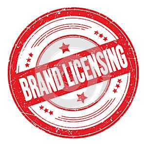BRAND LICENSING text on red round grungy stamp