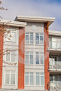 Brand new apartment building on sunny day in BC, Canada. Architectural details of modern apartment building