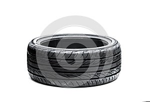 Brand new asymmetric type low profile sport tyre isolated on white