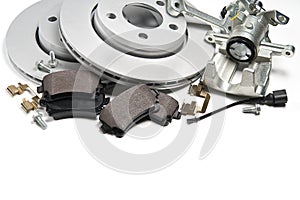 Brand new brake discs, brake caliper and brake pad set for car. isolated on white with copy space.