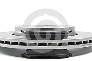 Brand new brake discs and brake pad set for car. isolated on white with copy space.