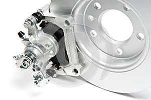 Brand new brake discs, brake caliper and brake pad set for car. isolated on white with copy space.