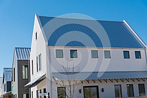 Brand new metal roof with covered gutter on two story townhome near Oklahoma City, US