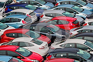 Brand new motor vehicles crowed in a parking lot