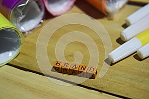 Brand on wooden cubes with colorful paper and pen, Concept Inspiration on wooden background