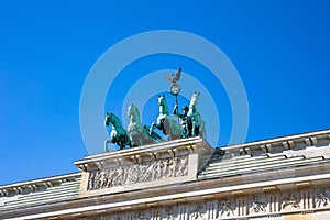 Brandenburg gate, Berlin, Germany, low angle against blue sky.