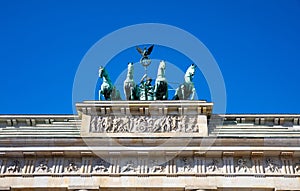 Brandenburg gate, Berlin, Germany, low angle against blue sky.