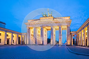 The Brandenburg Gate monument at night in Berlin city, Germany