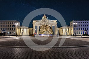 The Brandenburger Tor in Berlin during night with a Christmas tree