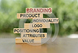 Branding concept on wooden blocks: product, individuality, logo, postioning, attributes, value