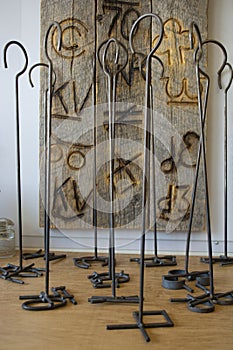 Branding Irons for Cattle Standing up on Display