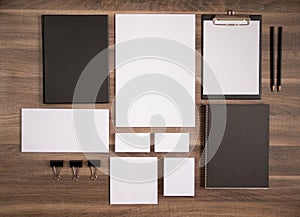 Branding mockup collection on brown wooden desk