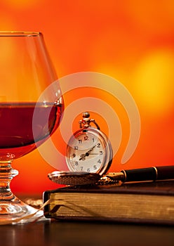 Brandy glass, diary and pocket watch