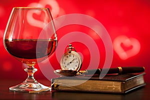 Brandy glass, diary and pocket watch