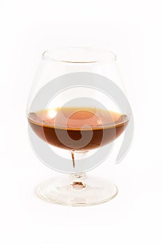 Brandy in glass over white