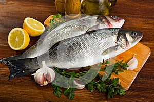 Branzino fish on cutting board