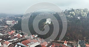Brasov Old Town. Aerial footage. Camera moves ofer the roofs of the houses