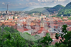 Landmark attraction in Brasov, Romania. Panorama over the old town with the Council Square and the new town in background