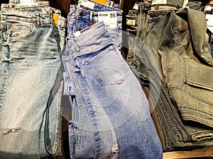 Jeans in different color and size at the local mall.