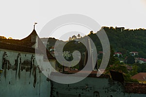 Brasov, Transylvania. Romania: The beautiful landscape of the city in the evening. Panorama of the old town at sunset