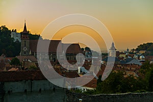 Brasov, Transylvania. Romania: The beautiful landscape of the city in the evening. Panorama of the old town at sunset