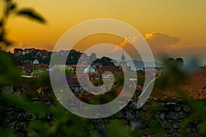 Brasov, Transylvania. Romania: The beautiful landscape of the city in the evening. Panorama of the old town at sunset