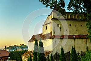 Brasov, Transylvania. Romania: The beautiful landscape of the city in the evening. Panorama of the old town at sunset