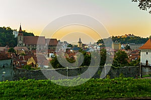 Brasov, Transylvania. Romania: The beautiful landscape of the city in the evening. Panorama of the old town at sunset