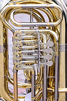 Brass bass tuba with valves closeup