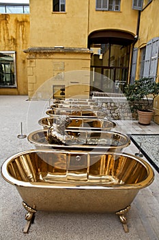 Brass Bathtubs and Statue