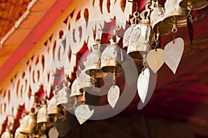 Brass bell on temple corridor ceiling.