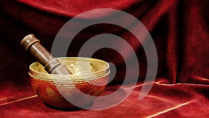 Brass bowl with a wooden mallet