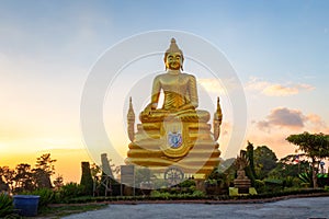 Brass Buddha Statue near the Big Buddha in sunset