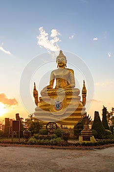 Brass Buddha Statue in sunset