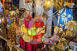 Brass chandeliers for sale in a market in a souk in the Medina around the Jemaa el-Fnaa square in Marrakesh Morocco