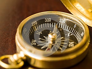 Brass Compass on Wood