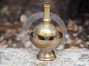 Brass Container Pour water of dedication to make libation, Buddhism Buddhist beliefs photo