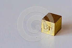 Brass cube with alloy name Br on it on