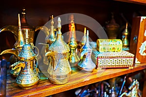 The brass dallah coffee pots in souvenir store of Al Souk al Kabir Old Market in Dubai, UAE