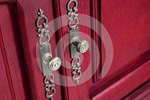 Brass door handles with ornate escutcheons
